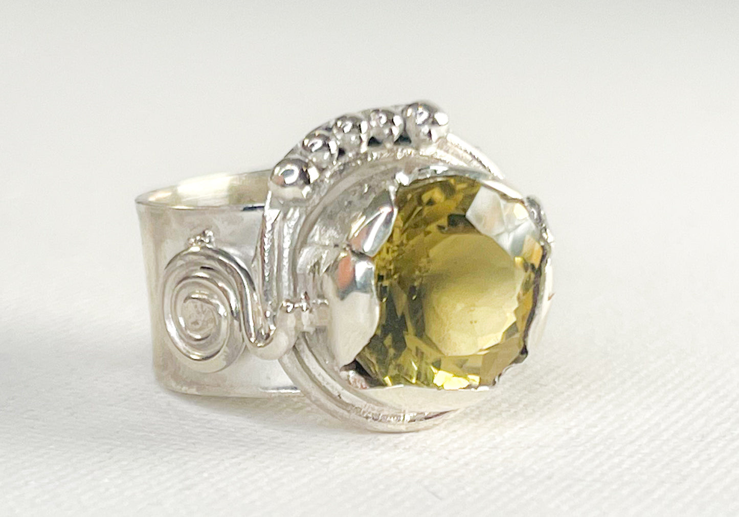 Silver Ring with Green Golden Crystal